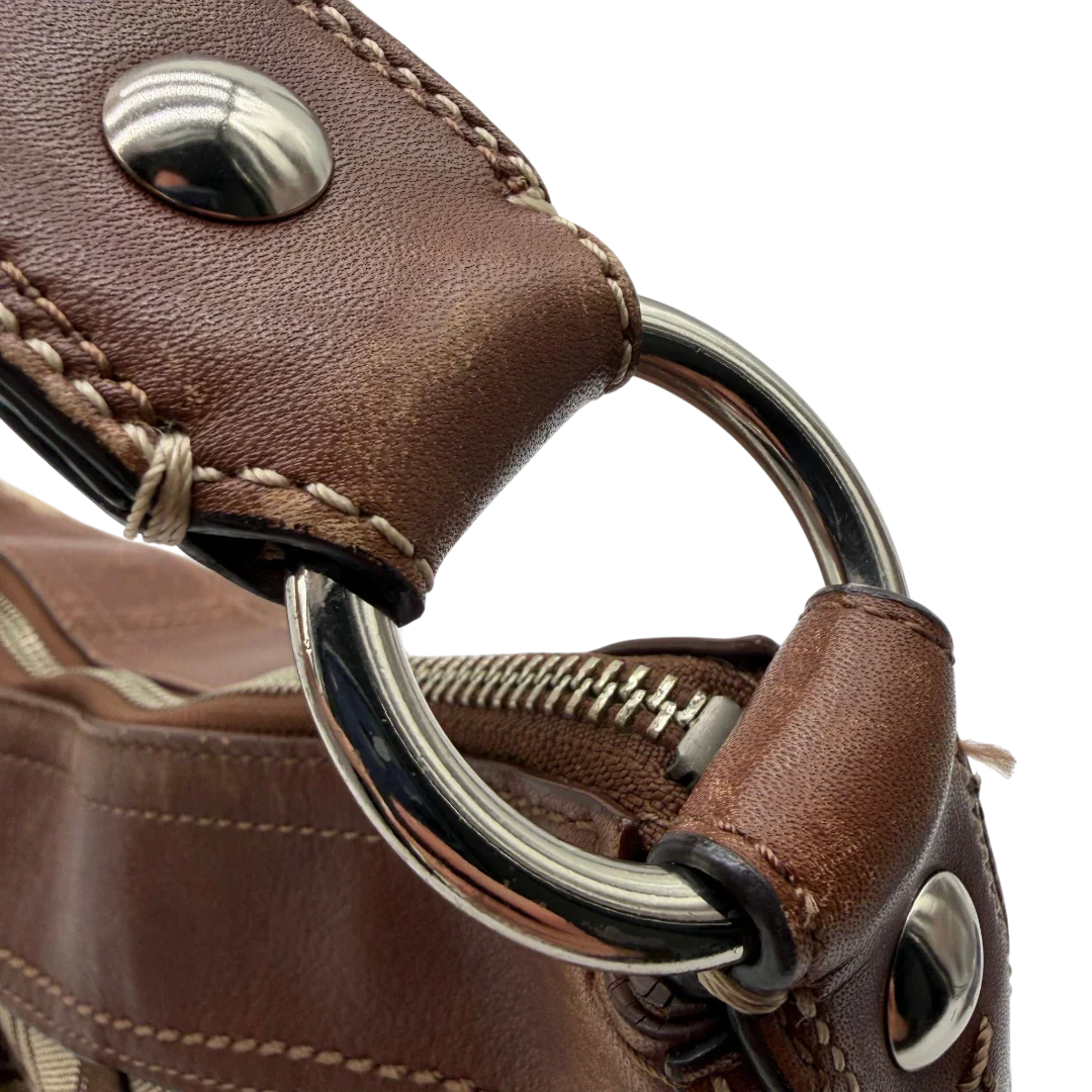 https://cdn.shopify.com/s/files/1/0564/9376/8855/files/Coach_Schultertasche_Signature_large_beige___braun_vintage8046.webp?v=1780489160