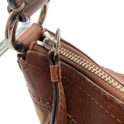 https://cdn.shopify.com/s/files/1/0564/9376/8855/files/Coach_Schultertasche_Signature_large_beige___braun_vintage8047.webp?v=1780489160