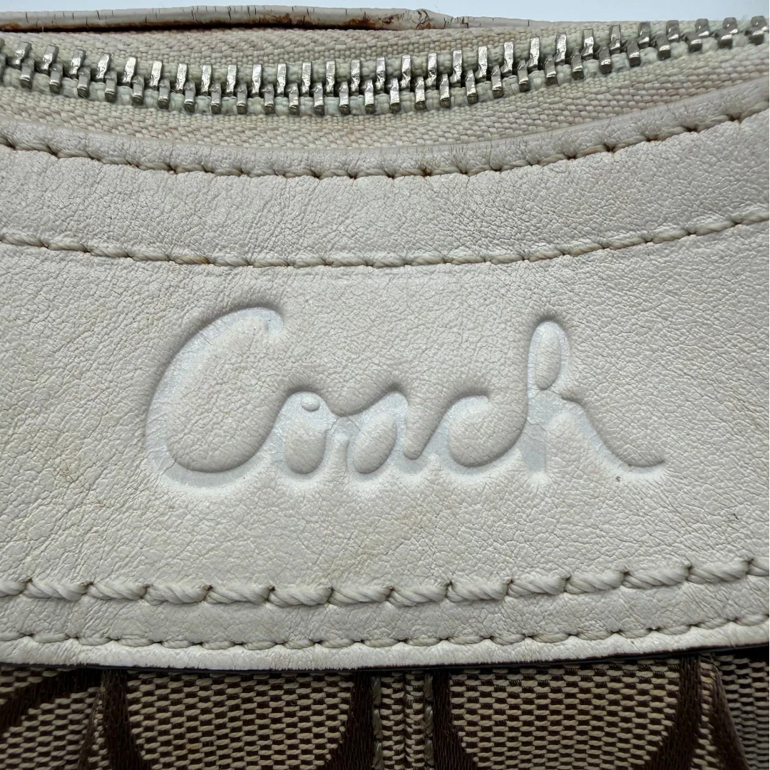 https://cdn.shopify.com/s/files/1/0564/9376/8855/files/Coach_Schultertasche_Signature_large_beige___weiss_vintage7999.webp?v=1780489241