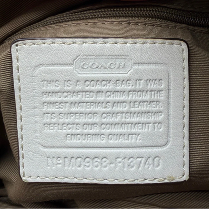 https://cdn.shopify.com/s/files/1/0564/9376/8855/files/Coach_Schultertasche_Signature_large_beige___weiss_vintage8004.webp?v=1780489241