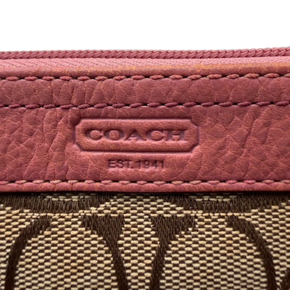 https://cdn.shopify.com/s/files/1/0564/9376/8855/files/Coach_Schultertasche_mit_zwei_Taschen_Signature_beige_vintage8025.webp?v=1780489439