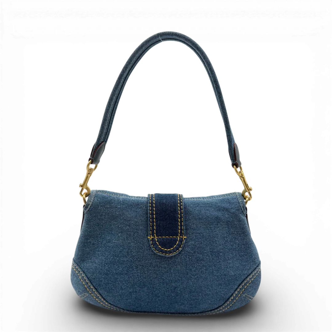 https://cdn.shopify.com/s/files/1/0564/9376/8855/files/Coach_Soho_Flap_Bag_Repurposed_Denim_vintage2496.webp?v=1773326402