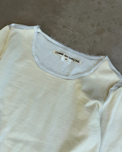 Comme des Garçons AW2012 Wool and Mesh Long Sleeve T-Shirt – M-on a concrete background