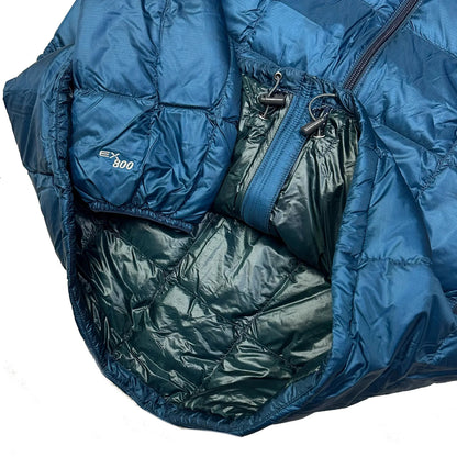 Close-up of a blue Montbell Superior Down Parka puffer jacket showing the internal lining and EX 800 tag.