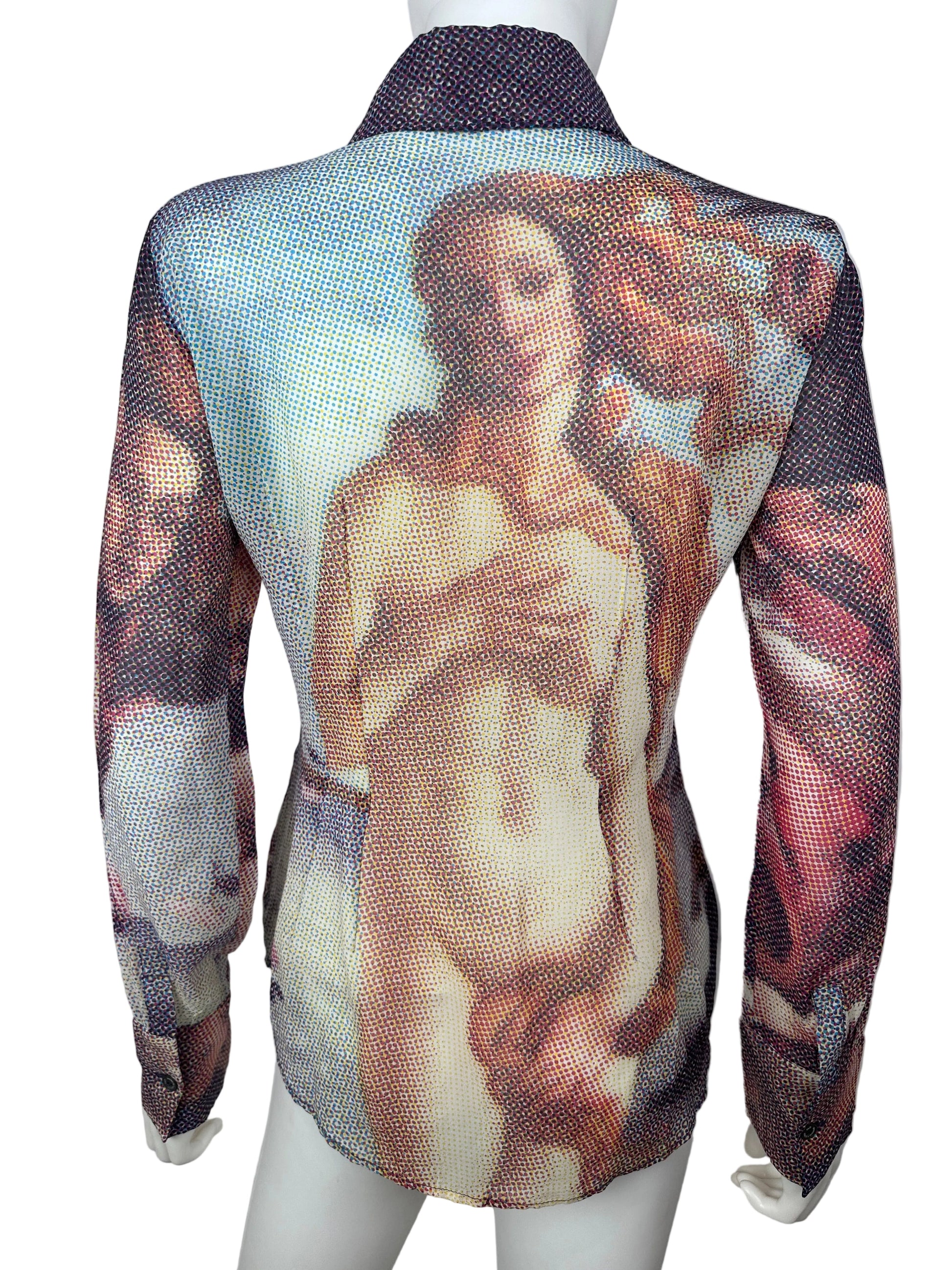 A sheer mesh wrap or shawl featuring a classical painting print of a reclining nude woman, draped over a white mannequin torso against a plain light background.