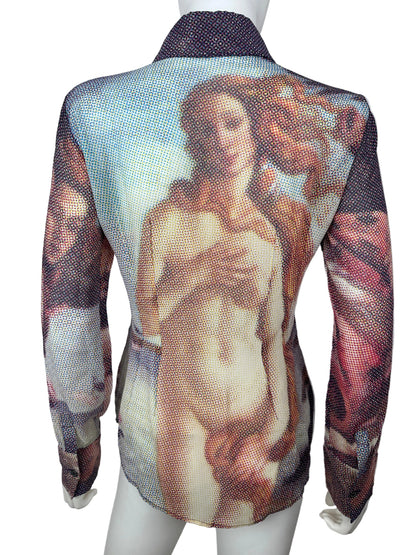A sheer mesh wrap or shawl featuring a classical painting print of a reclining nude woman, draped over a white mannequin torso against a plain light background.
