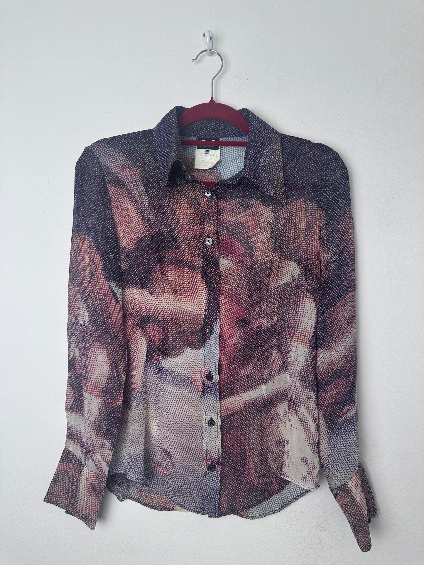 Birth of venus print shirt on a red hanger