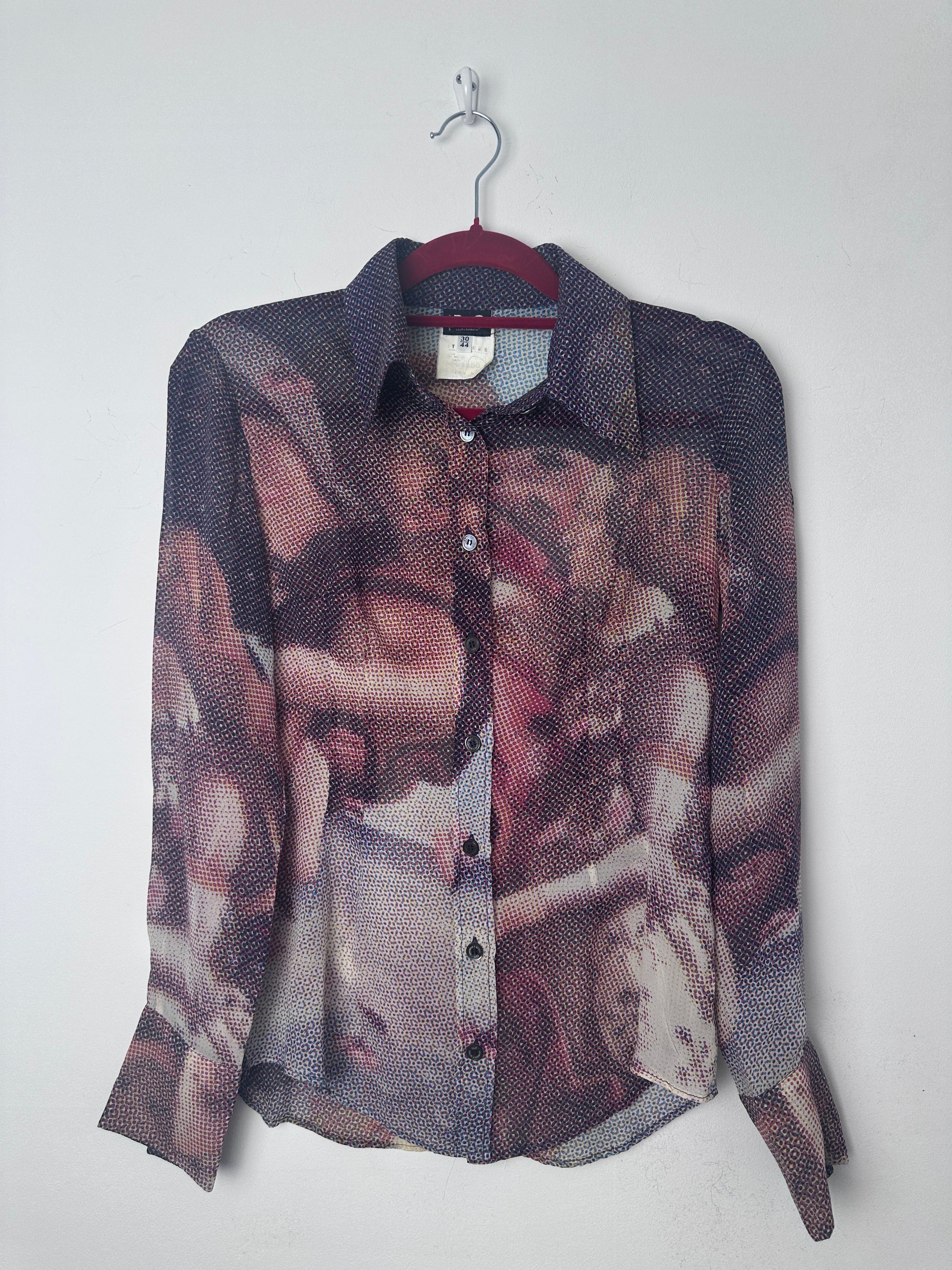 Birth of venus print shirt on a red hanger