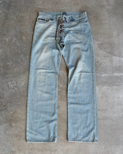 Dolce & Gabbana Light Blue Distressed Wide Leg Jeans with Leather Lace Up Fly – M-on a concrete background
