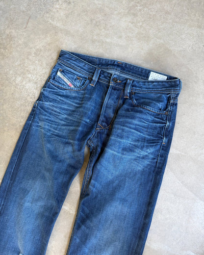 Diesel Mid Blue Distressed Straight Leg Jeans – W30/L28-on a concrete background