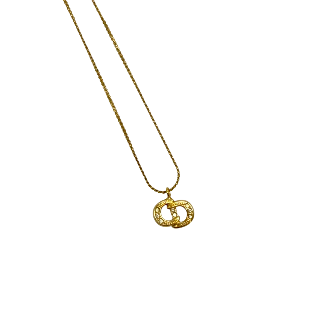 https://cdn.shopify.com/s/files/1/0564/9376/8855/files/Dior_Halskette_mit_Strasssteinen_gold_vintage7765.webp?v=1779406149