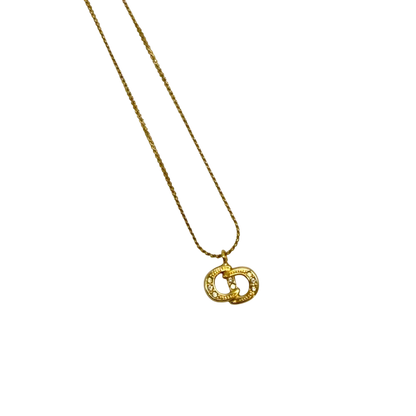 https://cdn.shopify.com/s/files/1/0564/9376/8855/files/Dior_Halskette_mit_Strasssteinen_gold_vintage7765.webp?v=1779406149
