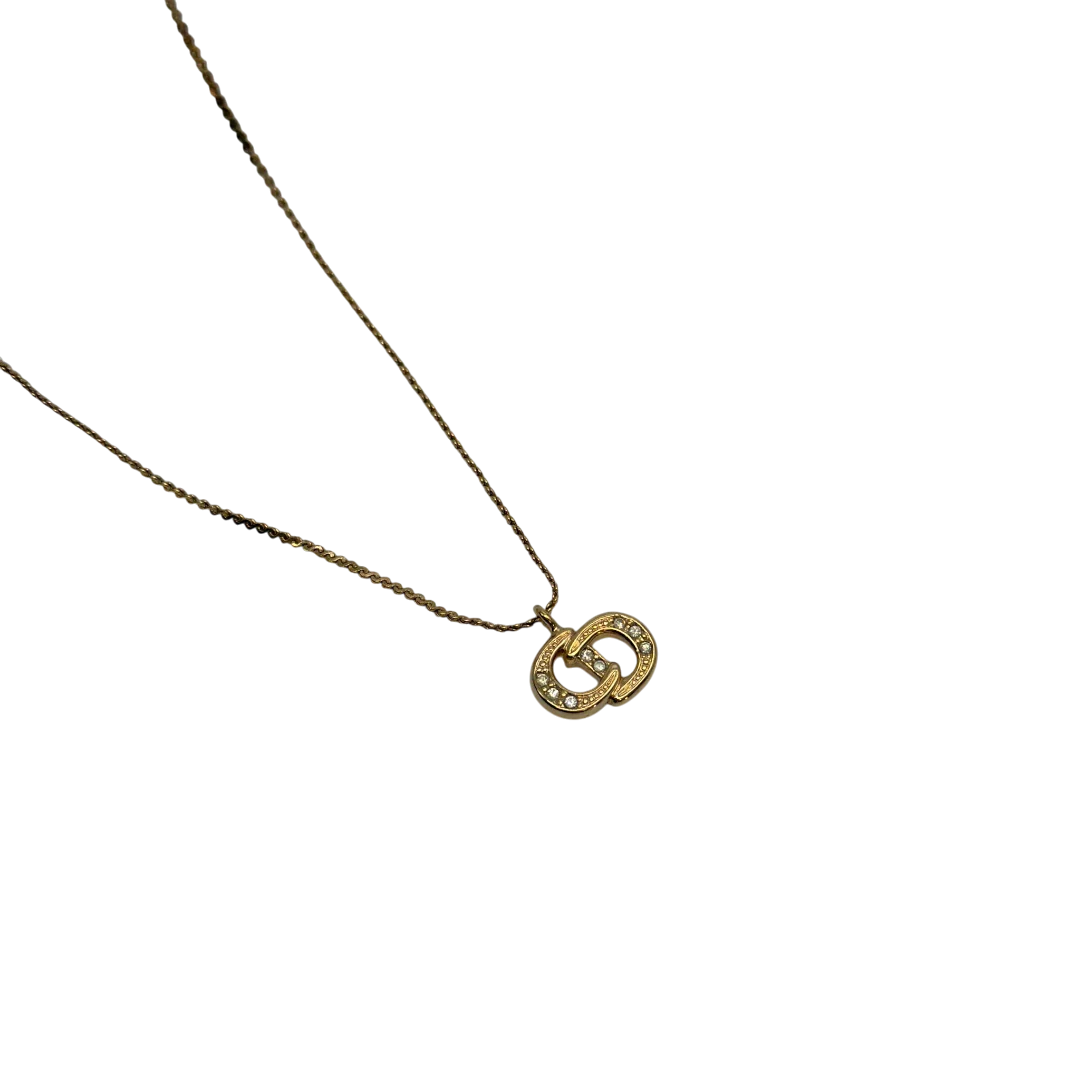 https://cdn.shopify.com/s/files/1/0564/9376/8855/files/Dior_Halskette_mit_Strasssteinen_gold_vintage7767.webp?v=1779406149