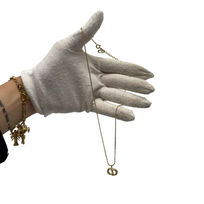 https://cdn.shopify.com/s/files/1/0564/9376/8855/files/Dior_Halskette_mit_Strasssteinen_gold_vintage7768.webp?v=1779406149