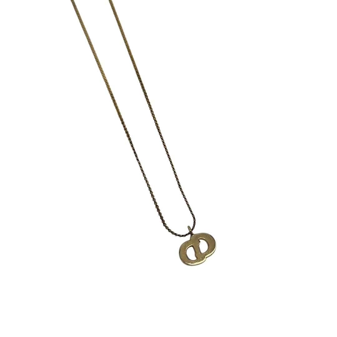 https://cdn.shopify.com/s/files/1/0564/9376/8855/files/Dior_Halskette_mit_Strasssteinen_gold_vintage7772.webp?v=1779406149