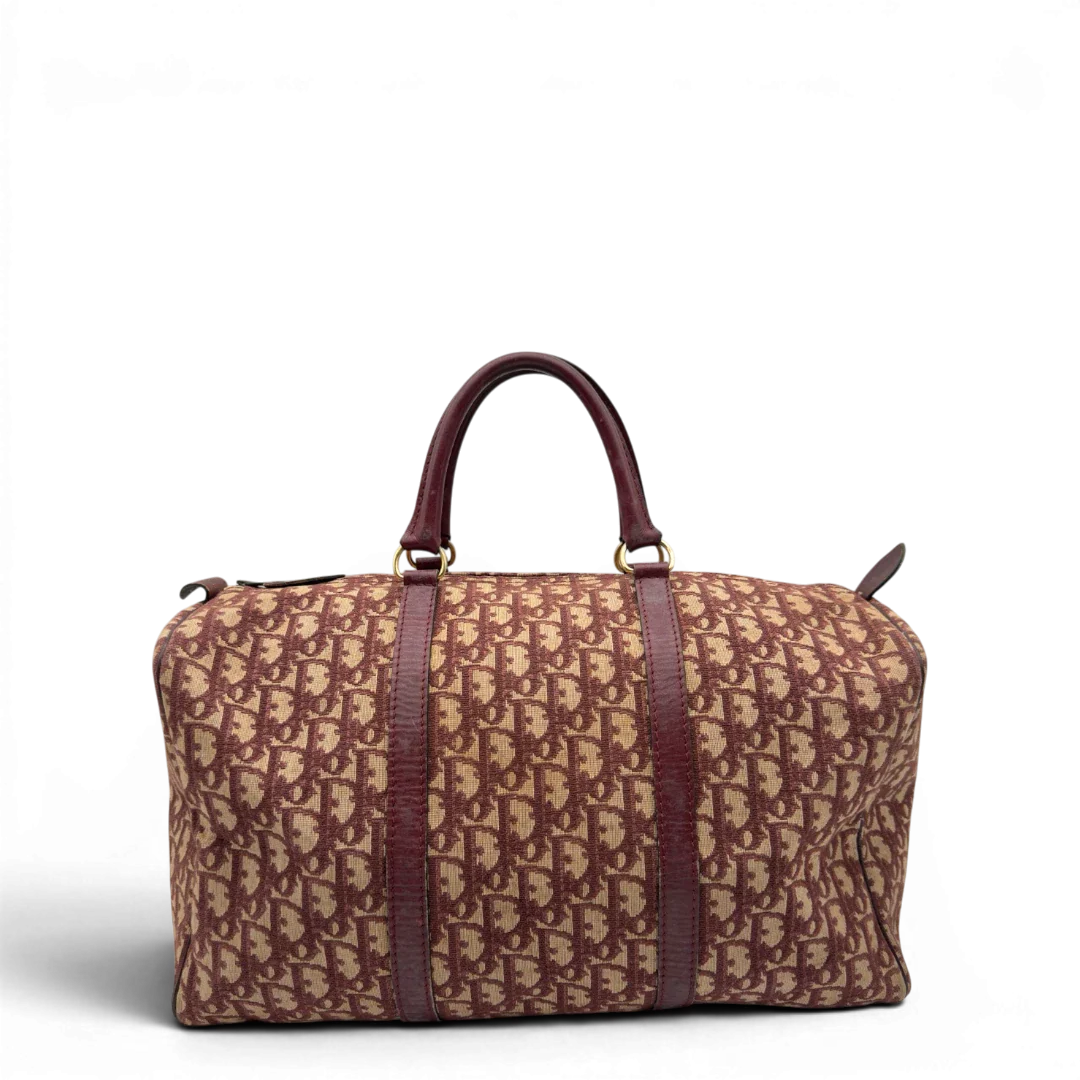 https://cdn.shopify.com/s/files/1/0564/9376/8855/files/Dior_Handtasche_Boston_40_vintage_monogram_beige_rot_1.webp?v=1784247347
