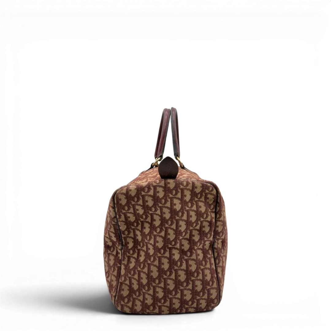 https://cdn.shopify.com/s/files/1/0564/9376/8855/files/Dior_Handtasche_Boston_40_vintage_monogram_beige_rot_4.webp?v=1784247347