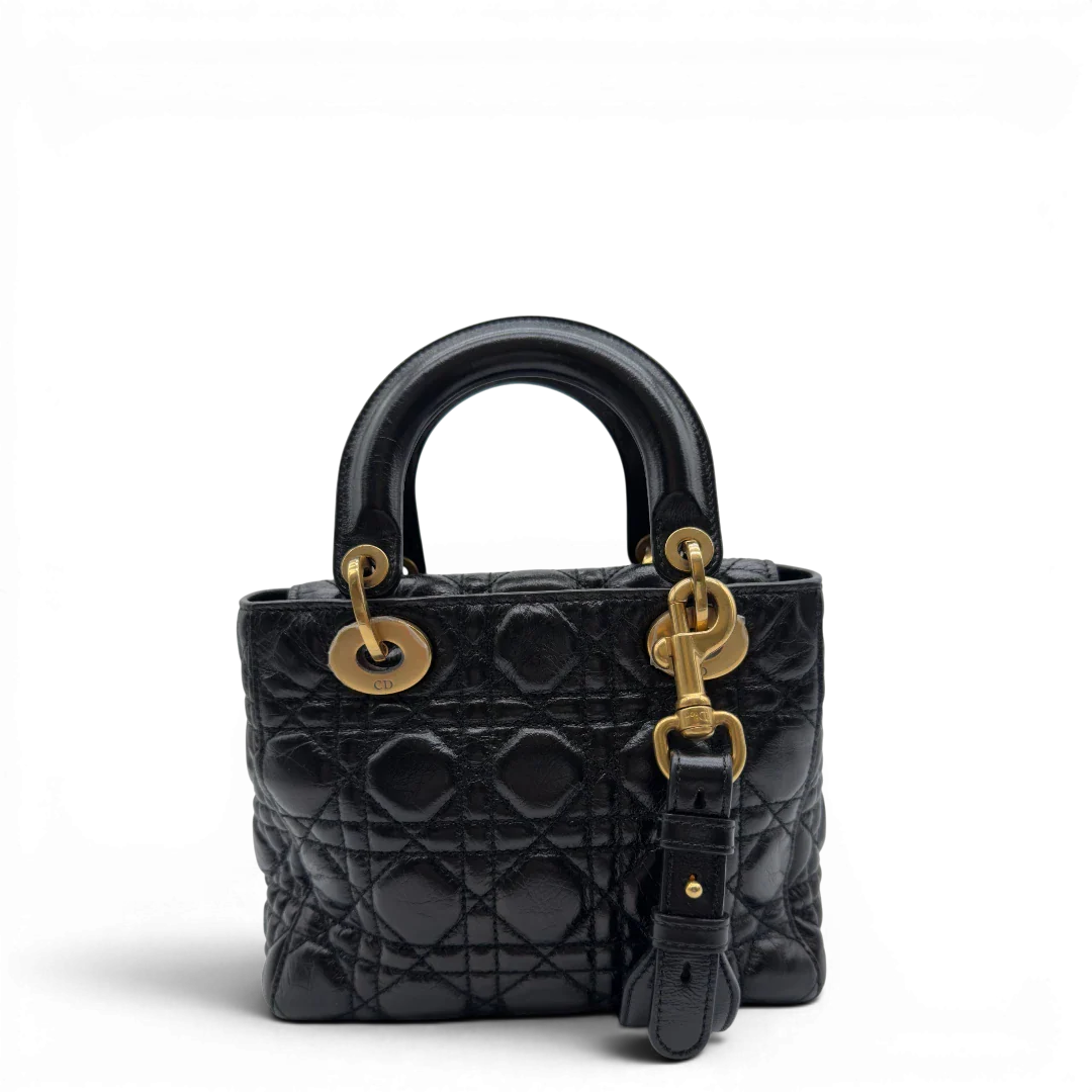 https://cdn.shopify.com/s/files/1/0564/9376/8855/files/Dior_Handtasche_Lady_Dior_medium_aus_Lammleder_schwarz_vintage8404.webp?v=1780486576