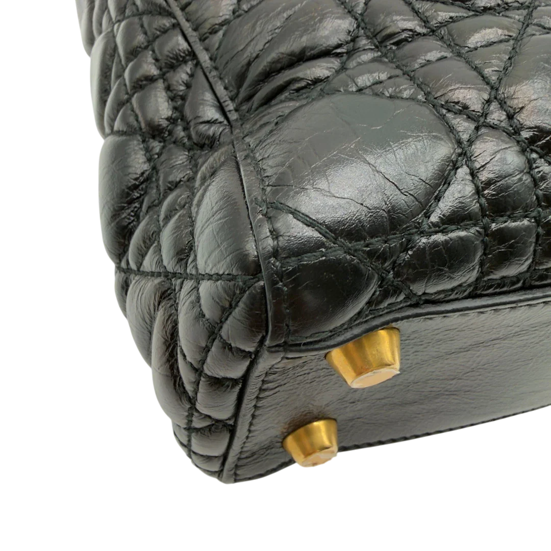 https://cdn.shopify.com/s/files/1/0564/9376/8855/files/Dior_Handtasche_Lady_Dior_medium_aus_Lammleder_schwarz_vintage8409.webp?v=1780486576