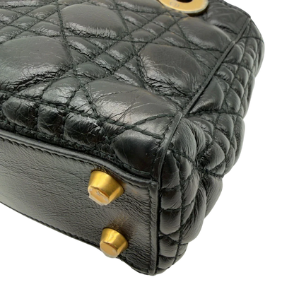 https://cdn.shopify.com/s/files/1/0564/9376/8855/files/Dior_Handtasche_Lady_Dior_medium_aus_Lammleder_schwarz_vintage8410.webp?v=1780486576