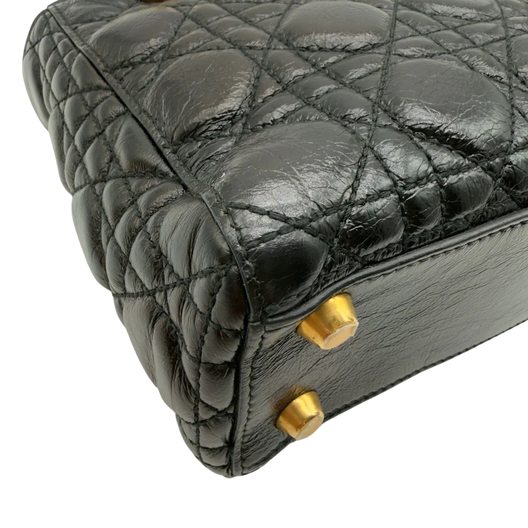 https://cdn.shopify.com/s/files/1/0564/9376/8855/files/Dior_Handtasche_Lady_Dior_medium_aus_Lammleder_schwarz_vintage8411.webp?v=1780486576