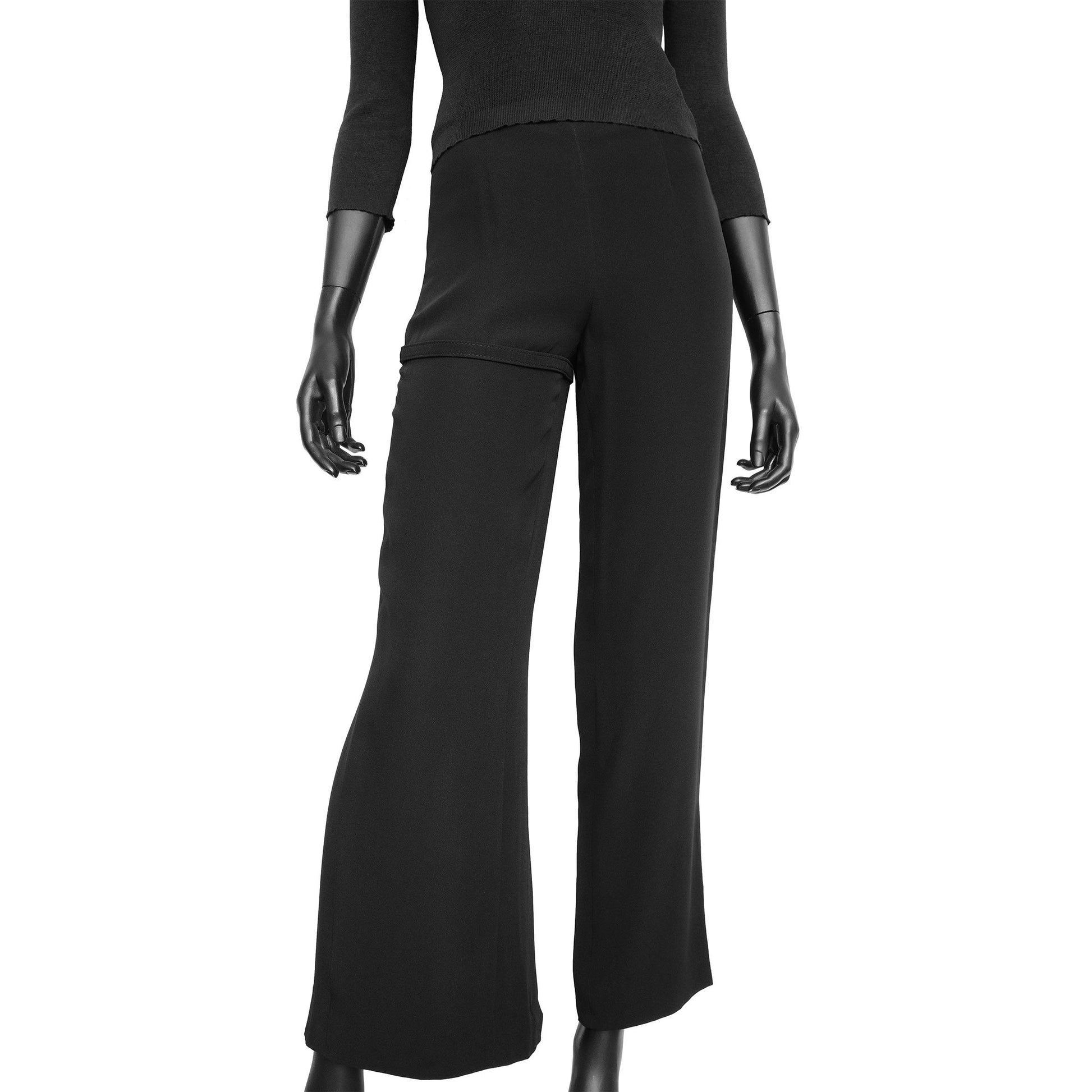 Dirk Bikkembergs SS 1997 tailored trousers with a buckle belt and back slit on the right leg. Size IT 38 / XS. Available at Artefact Archive.