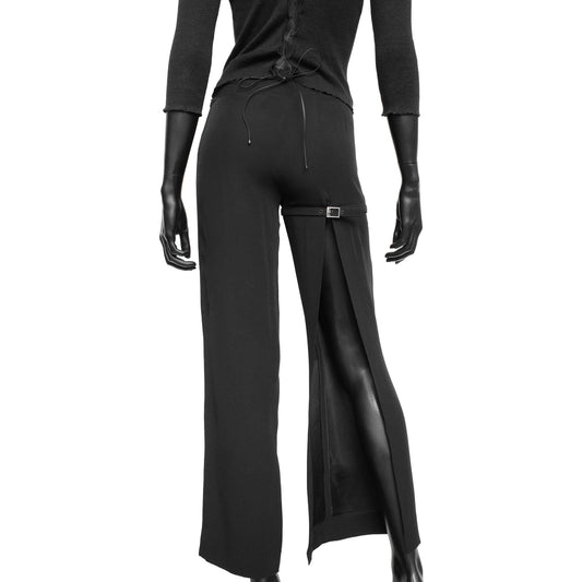 Dirk Bikkembergs SS 1997 tailored trousers with a buckle belt and back slit on the right leg. Size IT 38 / XS. Available at Artefact Archive.