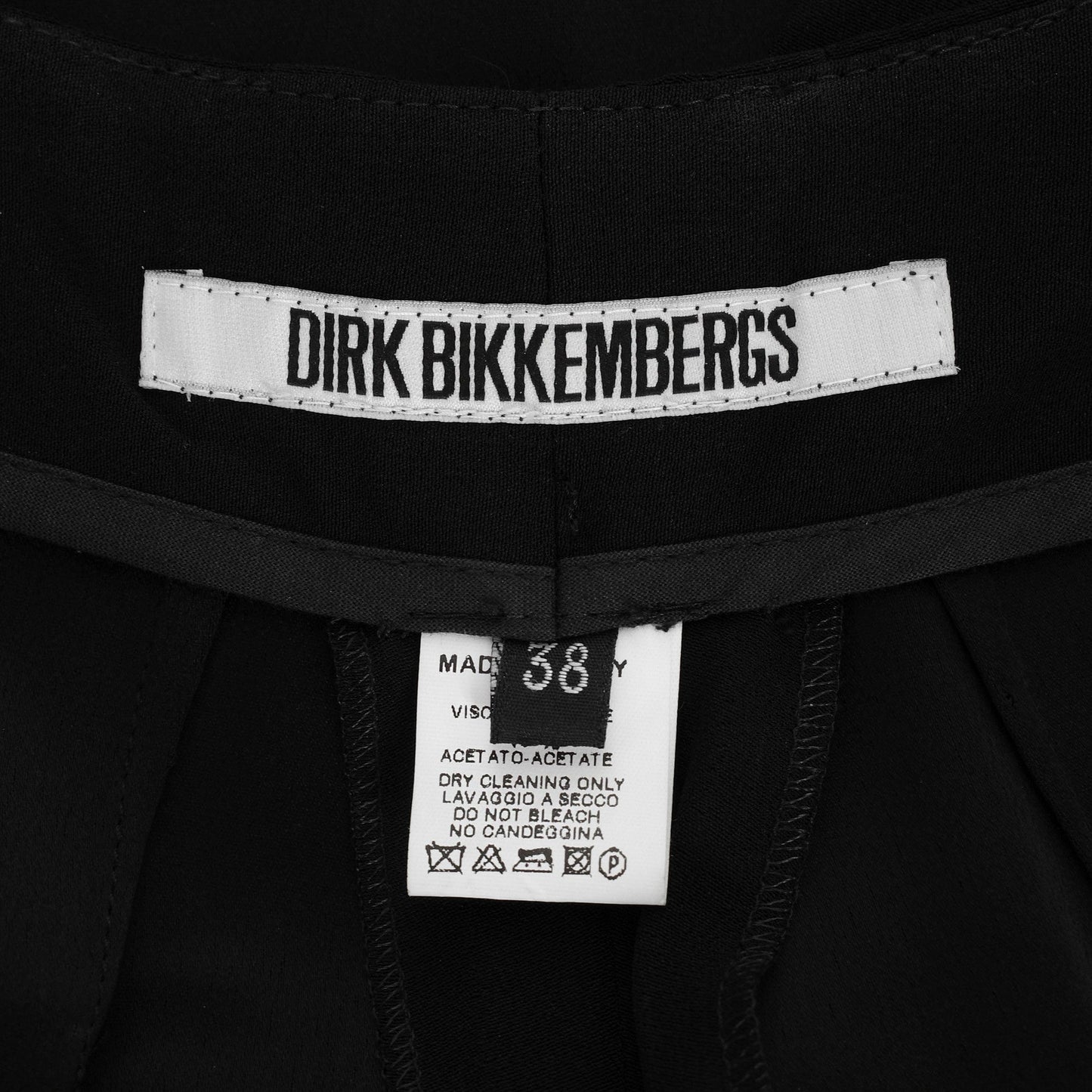Dirk Bikkembergs SS 1997 tailored trousers with a buckle belt and back slit on the right leg. Size IT 38 / XS. Available at Artefact Archive.