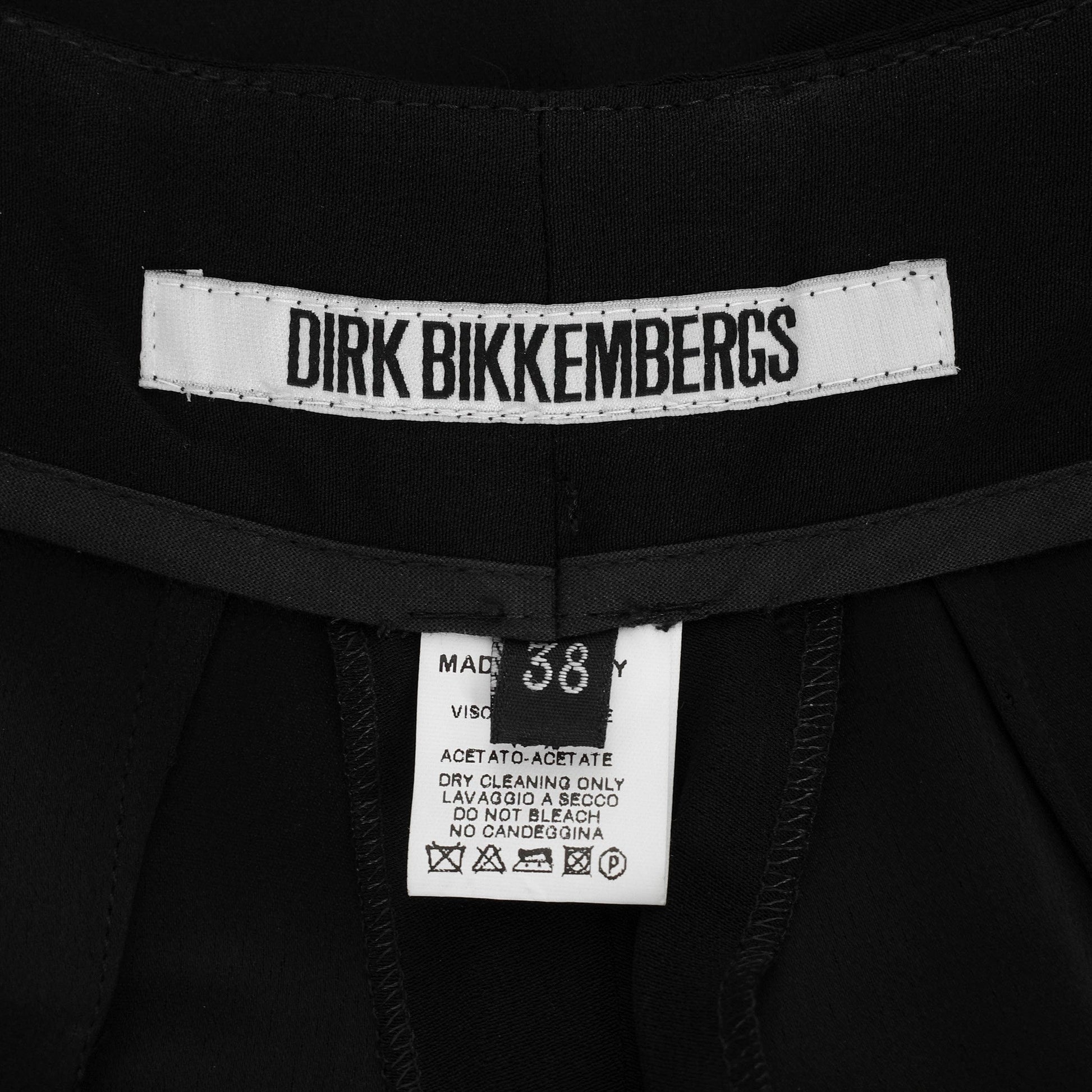 Dirk Bikkembergs SS 1997 tailored trousers with a buckle belt and back slit on the right leg. Size IT 38 / XS. Available at Artefact Archive.