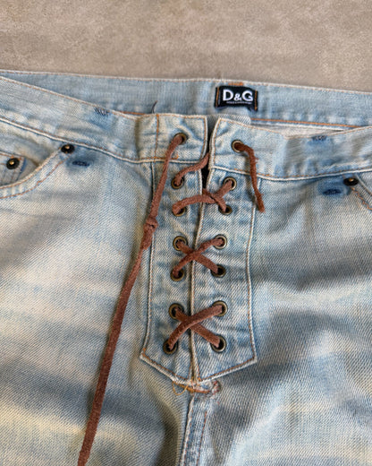 Dolce & Gabbana Light Blue Distressed Wide Leg Jeans with Leather Lace Up Fly – M-on a concrete background