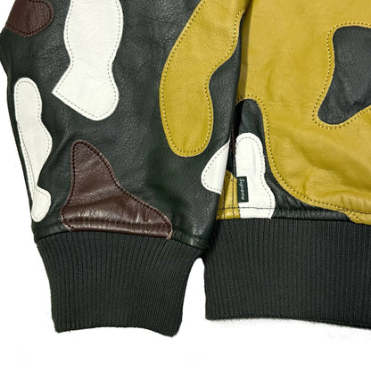 Close-up of a Supreme FW19 Camo Hooded Leather Jacket showing multi-color leather panels.
