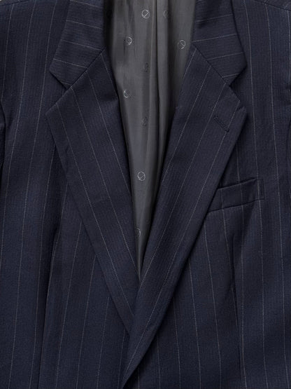 Christian Dior Le Connaisseur 1980s pure wool striped blazer in size 41R/L, tailored with classic style and bold stripe pattern.