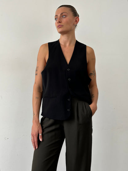 Emporio Armani high waisted tapered leg tailored trousers in black, front view showing fit and fabric details.