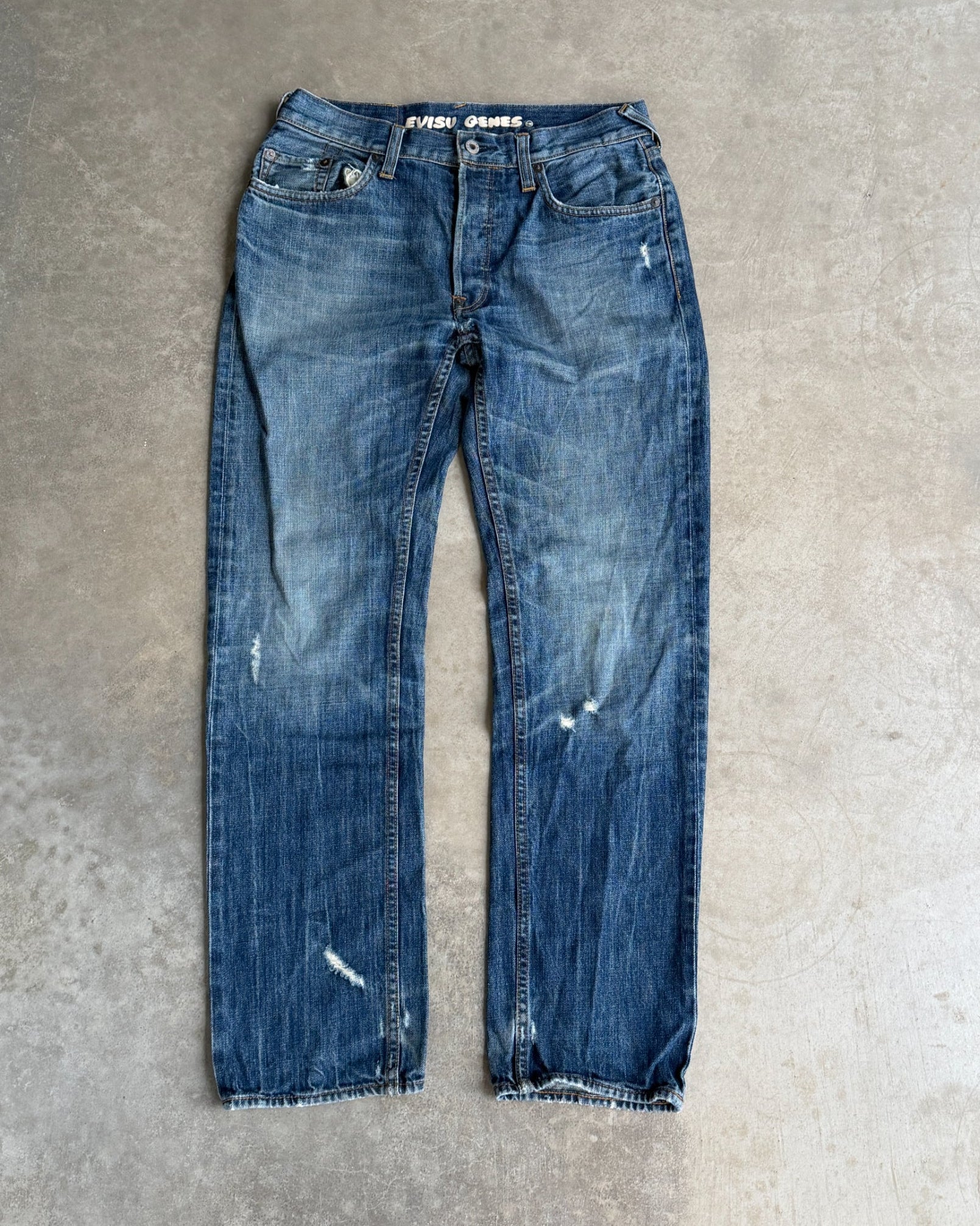 Vintage Evisu Jeans – W30–31-on a concrete background
