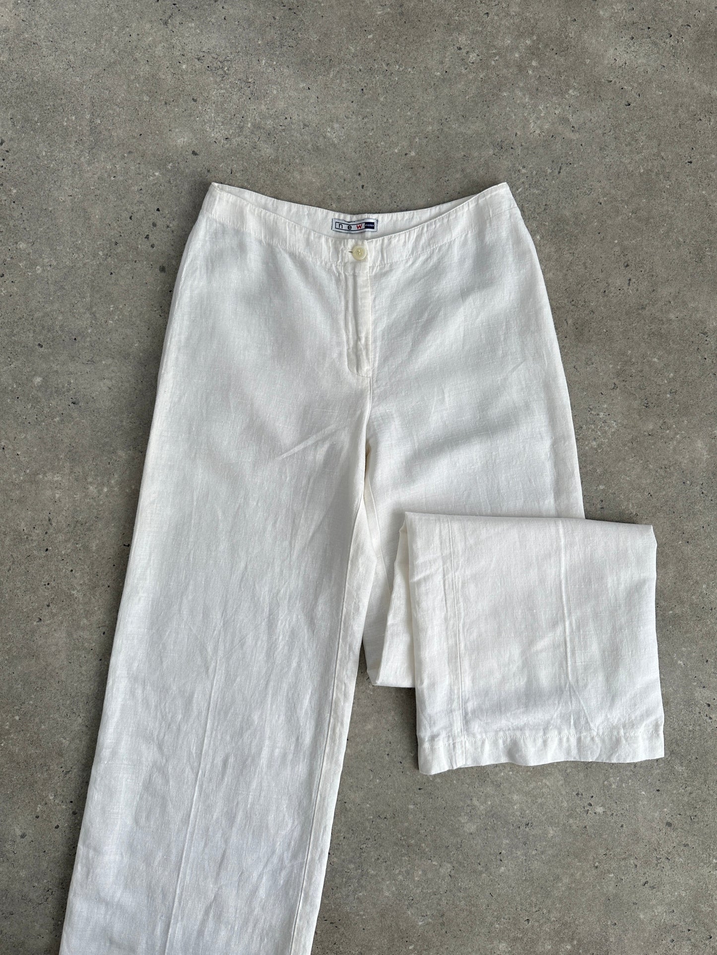 Vintage pure linen low waist wide-leg trousers in natural fabric, featuring a relaxed fit and classic style.