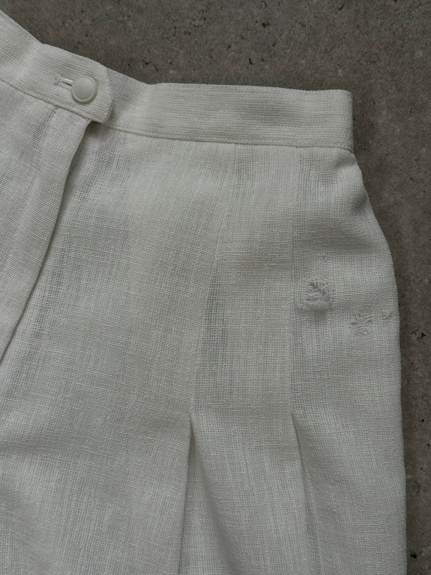 Vintage Japanese 1990s high-waisted pleated culottes shorts in a classic style, with a relaxed fit and wide leg design.