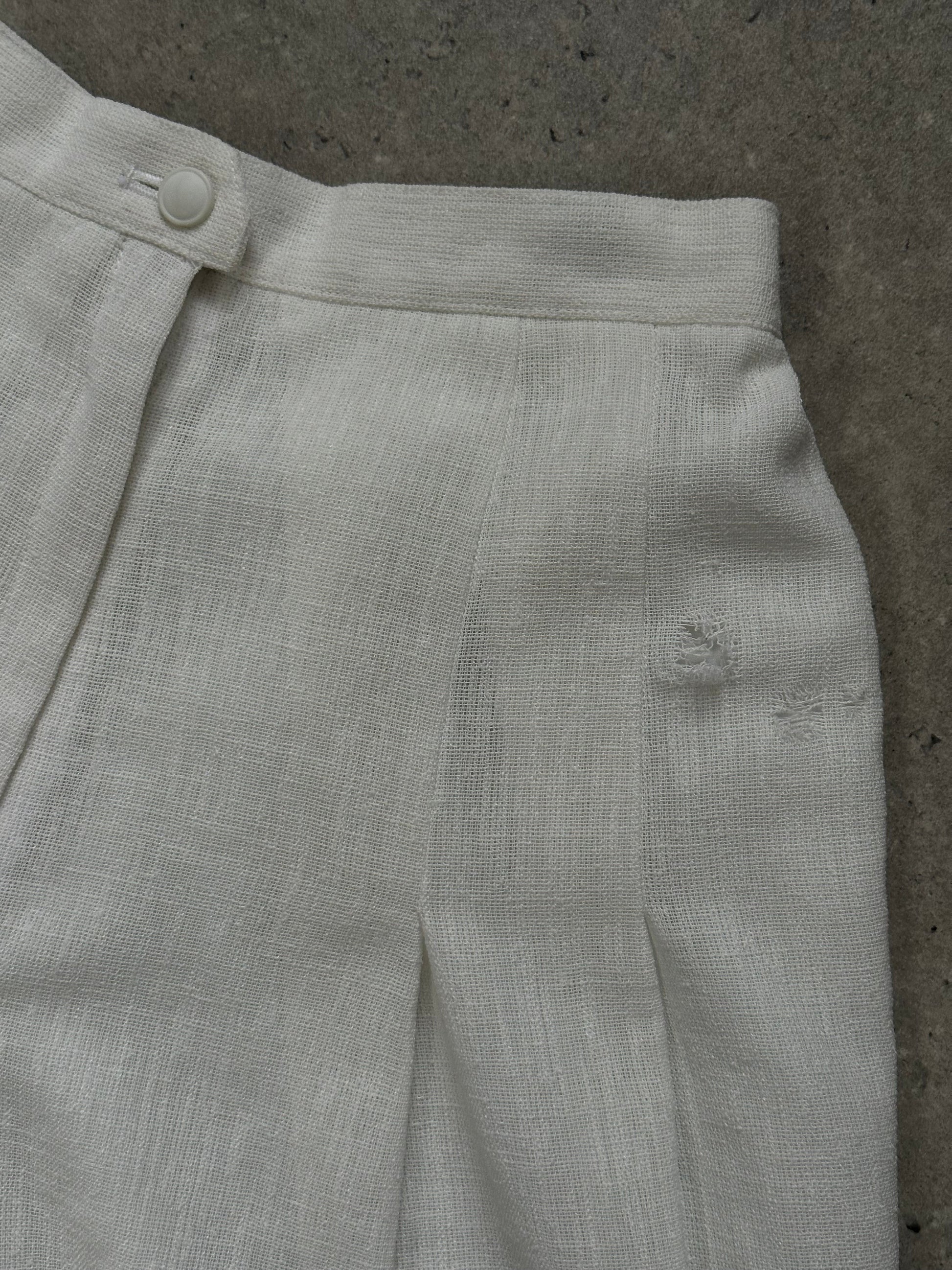 Vintage Japanese 1990s high-waisted pleated culottes shorts in a classic style, with a relaxed fit and wide leg design.