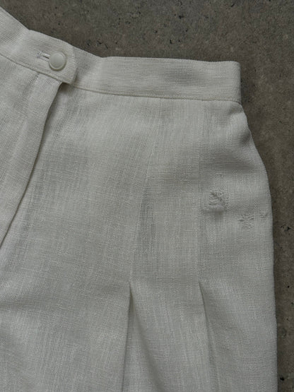 Vintage Japanese 1990s high-waisted pleated culottes shorts in a classic style, with a relaxed fit and wide leg design.