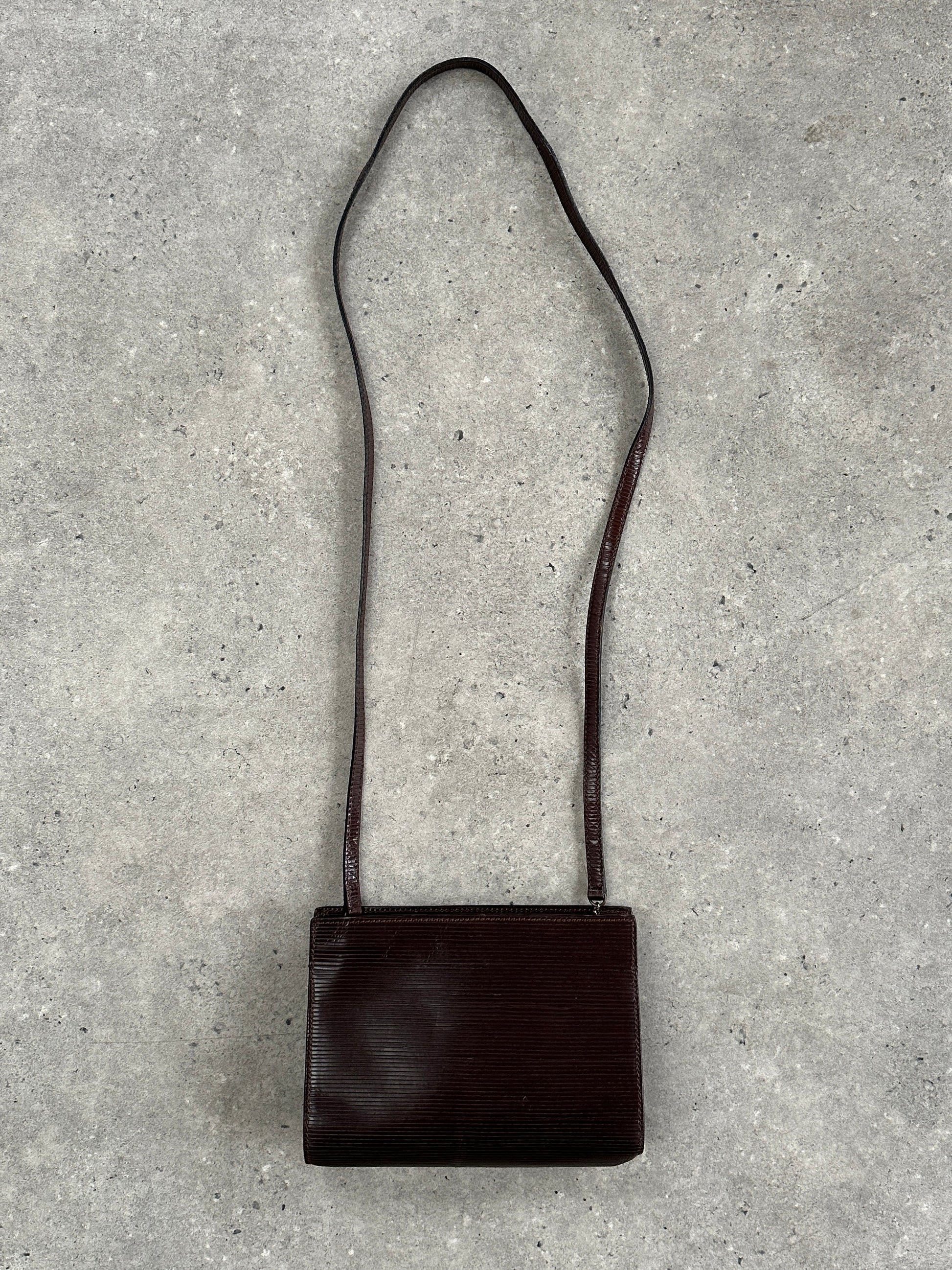 Giorgio Armani Le Collezioni 1990s leather crossbody bag with structured design and subtle brand details.