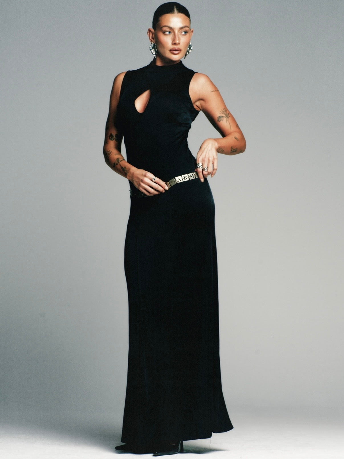 Gianni Versace Versus 1990s sleeveless cut-out floor-length dress, size S/M, featuring bold design and elegant silhouette.