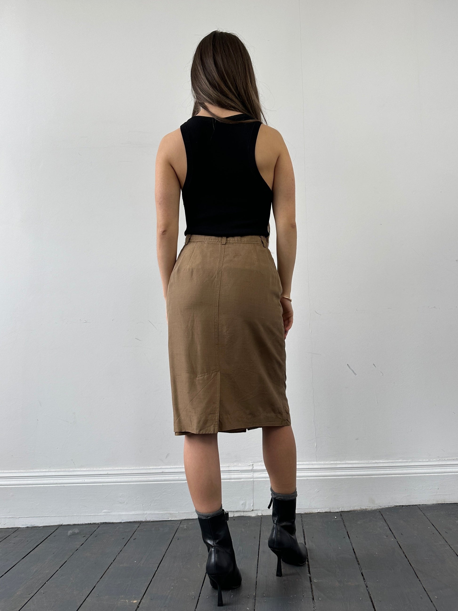 Jaeger pure silk button-down midi skirt in W24, featuring a sleek design and elegant button details, shown in a neutral color.