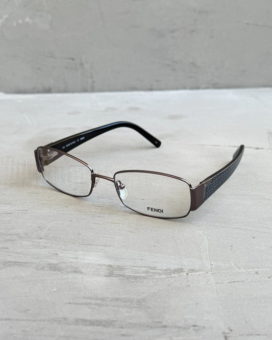 Fendi Clear Lens Silver Frame Glasses-on a concrete background