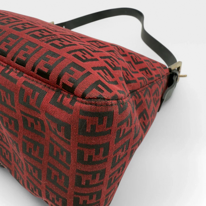 https://cdn.shopify.com/s/files/1/0564/9376/8855/files/Fendi_Handtasche_Mamma_Baguette_aus_Stoff_monogram_rot_vintage_luxury_FF_handbag_8672.webp?v=1741956508