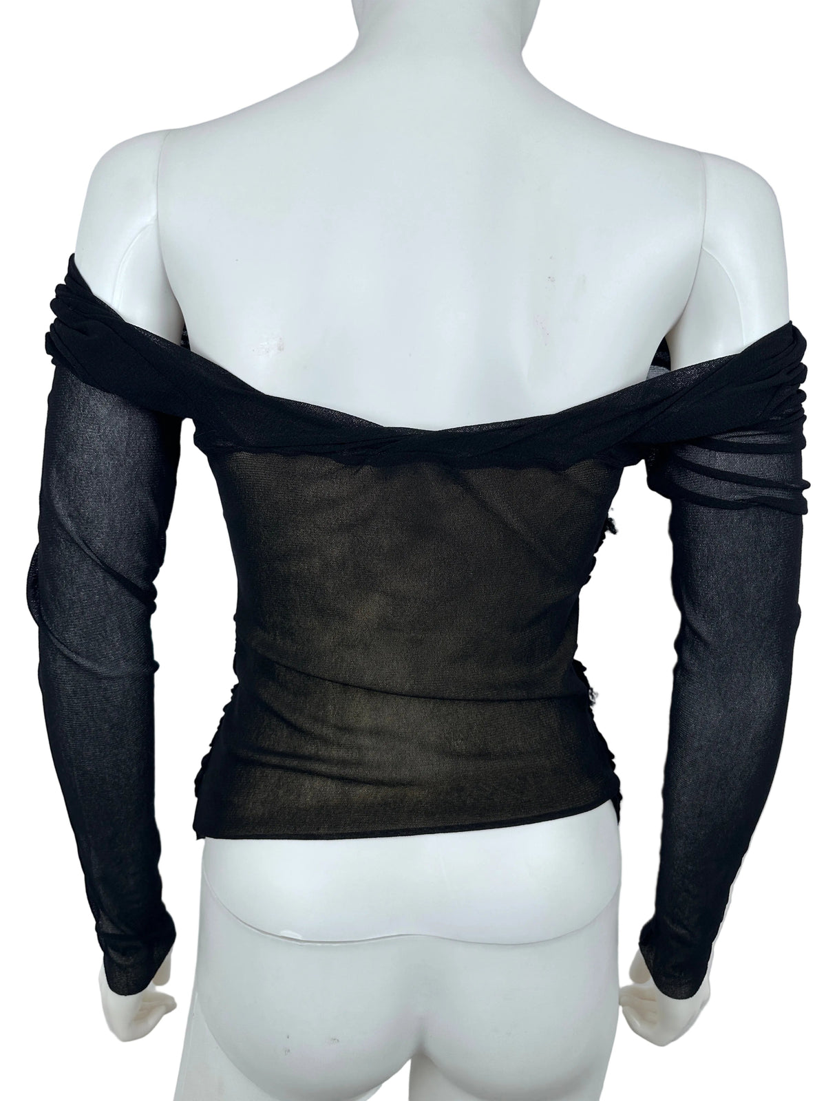 Black sheer fabric draped over a white mannequin on a light gray background