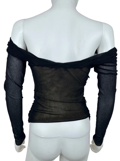 Black sheer fabric draped over a white mannequin on a light gray background