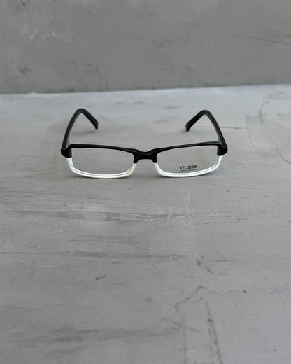 Guess Two Tone Black and White Clear Lens Glasses-on a concrete background