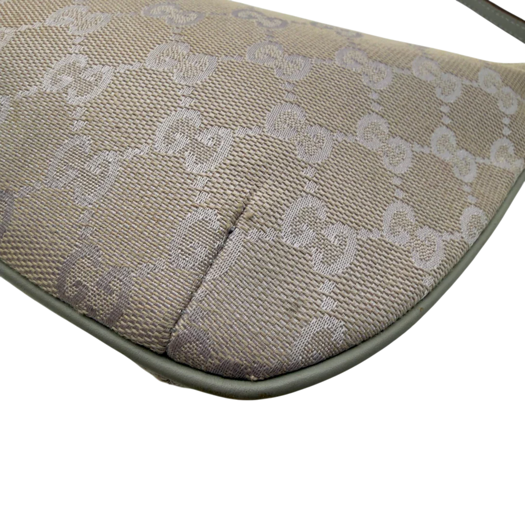 https://cdn.shopify.com/s/files/1/0564/9376/8855/files/GucciPochetteCroissantmonogramsilber7341.webp?v=1778681230