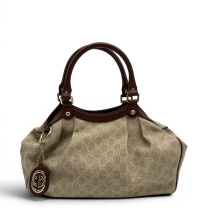 https://cdn.shopify.com/s/files/1/0564/9376/8855/files/GucciShopperSukeymonogrambeige7621.webp?v=1779408182