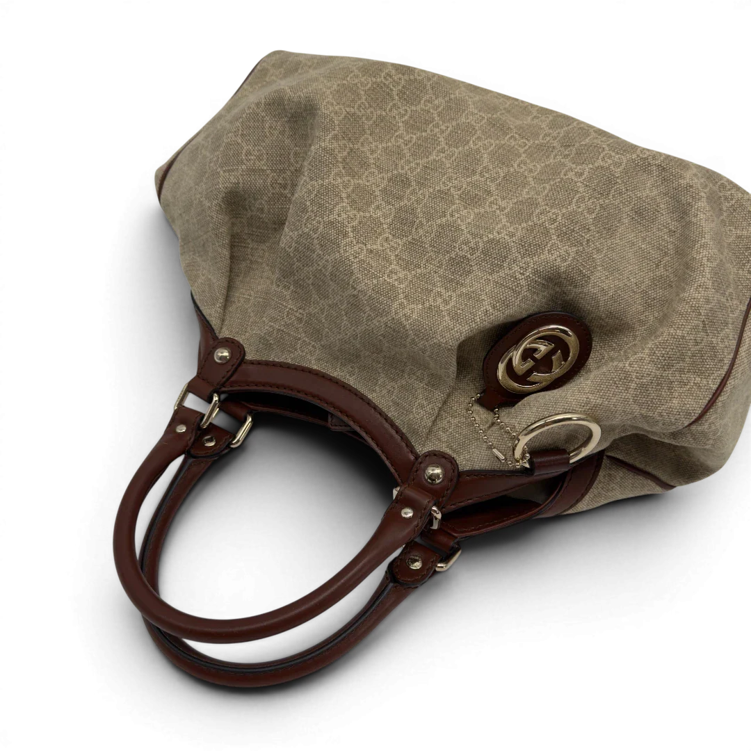 https://cdn.shopify.com/s/files/1/0564/9376/8855/files/GucciShopperSukeymonogrambeige7631.webp?v=1779408182