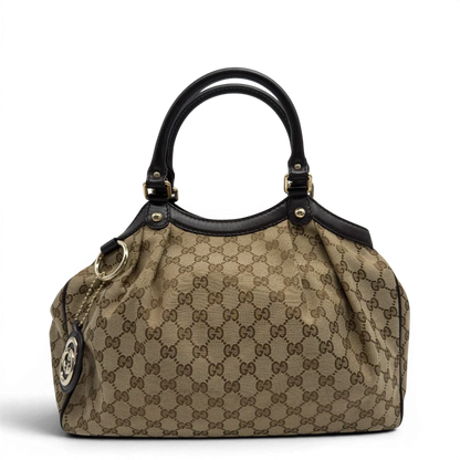 https://cdn.shopify.com/s/files/1/0564/9376/8855/files/GucciShopperSukeymonogrambeige7644.webp?v=1779408085